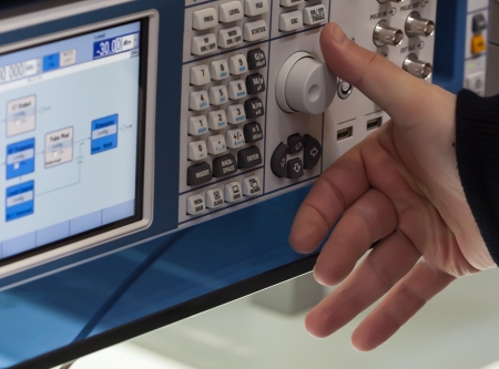 Man hand adjusting on deviceの写真素材