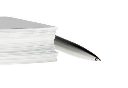 Office paper bundle with pen isolatedの写真素材