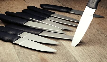 knifes with shine blades on wooden board