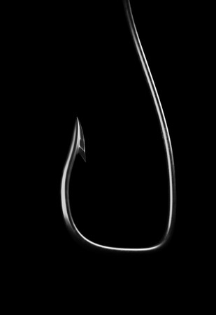 Barbed fish hook 3d render on blackの写真素材