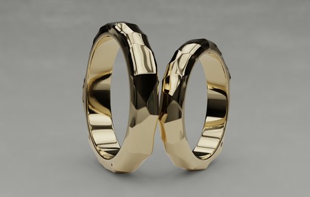 Two golden wedding rings isolated on white background, voronoi style. Symbol for marriage, love, relationships, proposals, valentines day, engagement 3d illustrationの写真素材