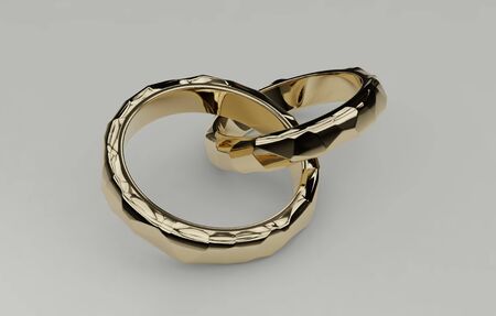 Two golden wedding rings intersected together isolated on white background, voronoi style. Symbol for marriage, love, relationships, proposals, valentines day, engagement 3d illustrationの写真素材