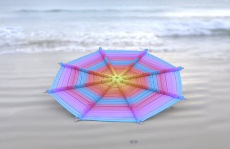 Colorful Mandalas on wood for anti-stress therapy and yoga on sand with sea view coast 3d illustrationの写真素材