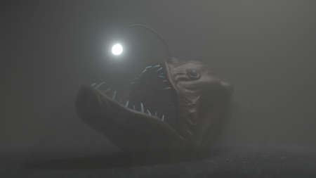 Angler fish on dark blue ocean water 3d illustration.の写真素材