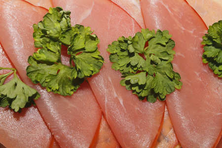 Ham, garnished with parsleyの写真素材