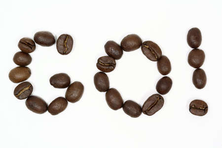Macro shot of coffee beans arranged to say go.の写真素材