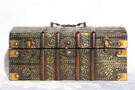 Wooden handmade decorative box on the tableの写真素材