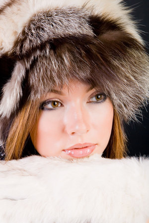 Close-up portrait of the girl in fur-capの写真素材