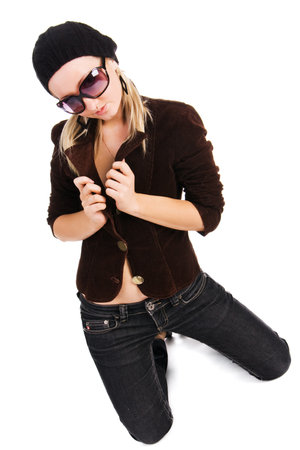 Picture of a beautiful young alluring girl in jacket on floor. Isolated on whiteの写真素材