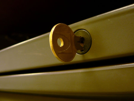 close up photo of modular desk drawer's key in its lockの写真素材