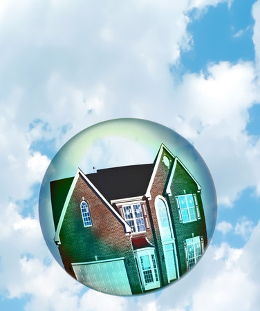 Housing market bubble concept photo with composition of home floating in a bubble depicting the fragility of the housing market. The house photo has been altered from its original appearance!の写真素材