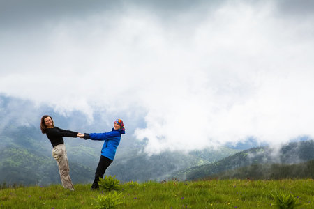 Happy girl enjoying the mountainsの写真素材