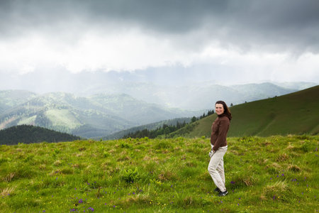 High mountain climber tourist traveling bad weatherの写真素材