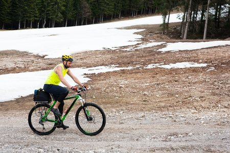 male cyclist rides in the mountains on the wayの写真素材