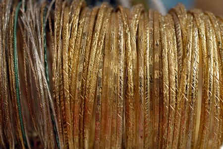 close up of gold braceletsの写真素材