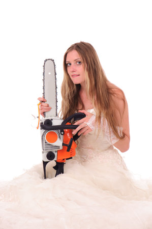 calm bride with saw isolated on whiteの写真素材