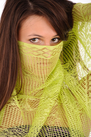 close up of woman face closed by green scarfの写真素材