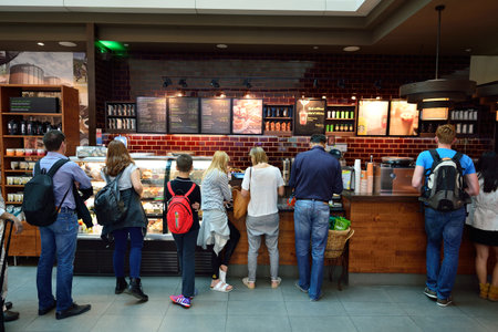 DUBAI, UAE - JUNE 23, 2015: Starbucks cafe interior. Starbucks Corporation, doing business as...