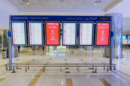 DUBAI, UAE - APRIL 18, 2014: airport interior. Dubai International Airport is an international airport serving Dubai. It is a major airline hub in the Middle East, and is the main airport of Dubai.のeditorial素材