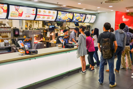 HONG KONG - APRIL 03, 2015: McDonald's restaurant interior. The McDonald's Corporation is the world's largest chain of hamburger fast food restaurants, serving around 68 million customers daily in 119 countries across 35,000 outletsのeditorial素材