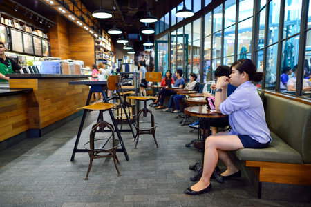 BANGKOK, THAILAND - JUNE 21, 2015: Starbucks Cafe interior. Starbucks Corporation is an American global coffee company and coffeehouse chain based in Seattle, Washingtonのeditorial素材