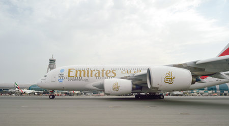 DUBAI, UAE - JUNE 23, 2015: Airbus A380 in Dubai airport. Dubai International Airport is an...