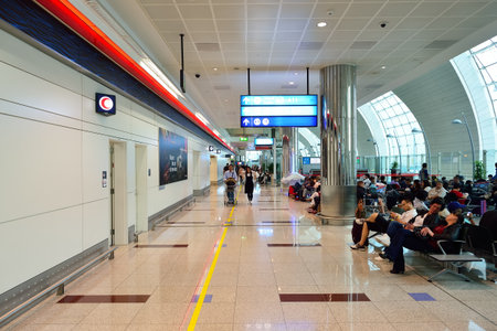 DUBAI, UAE - JUNE 23, 2015: airport interior. Dubai International Airport is a major international airport located in Dubai, and is the world's busiest airport by international passenger traffic.のeditorial素材