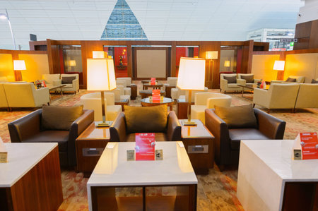 DUBAI - SEPTEMBER 08, 2015: Emirates business class lounge interior. Emirates is the largest airline in the Middle East. It is an airline based in Dubai, United Arab Emirates.のeditorial素材