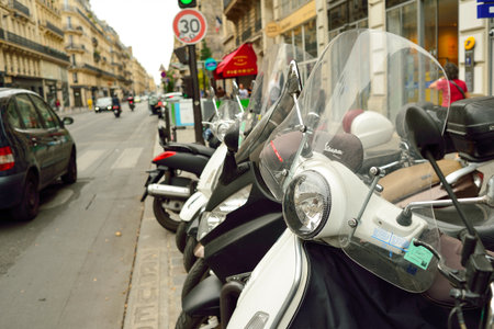 PARIS, FRANCE - AUGUST 09, 2015: modern and vintage motorbikes parked in the street of Paris. Paris, aka City of Love, is a popular travel destination and a major city in Europeのeditorial素材