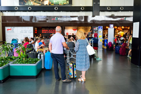ROME, ITALY - AUGUST 16, 2015: people in Fiumicino Airport. Fiumicino - Leonardo da Vinci International Airport is a major international airport in Rome, Italyのeditorial素材