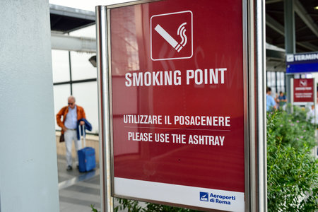 ROME, ITALY - AUGUST 16, 2015: smoking point in Fiumicino Airport. Fiumicino - Leonardo da Vinci International Airport is a major international airport in Rome, Italyのeditorial素材