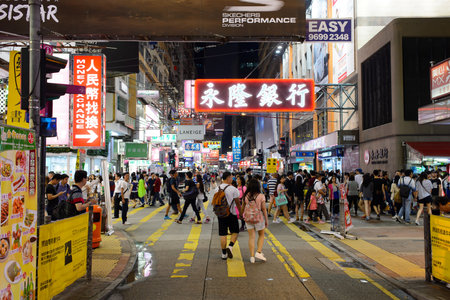 HONG KONG - JUNE 01, 2015: Mongkok area. Mong Kok is characterized by a mixture of old and new multi-story buildings, with shops and restaurants at street level and commercial or residential units above.のeditorial素材