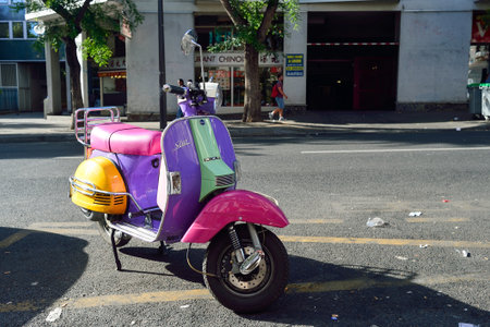 PARIS, FRANCE - AUGUST 10, 2015: parked bright colors scooter. Paris, aka City of Love, is a popular travel destination and a major city in Europeのeditorial素材