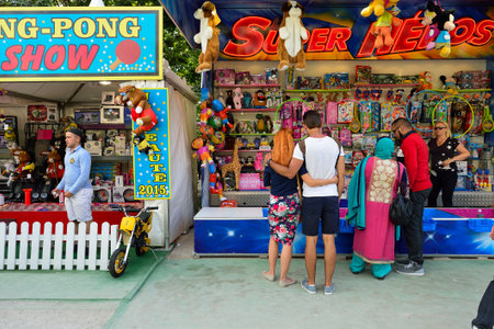 PARIS, FRANCE - AUGUST 09, 2015: amusement park near Louvre. Amusement parks evolved from European fairs and pleasure gardens, which were created for people's recreationのeditorial素材