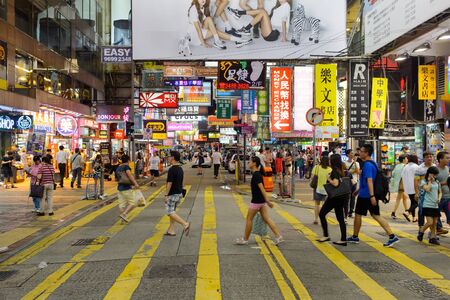 HONG KONG - JUNE 01, 2015: Mongkok area. Mong Kok is characterized by a mixture of old and new multi-story buildings, with shops and restaurants at street level and commercial or residential units above.のeditorial素材