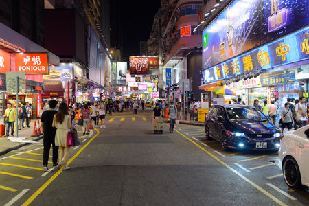 HONG KONG - JUNE 01, 2015: Mongkok area. Mong Kok is characterized by a mixture of old and new multi-story buildings, with shops and restaurants at street level and commercial or residential units above.のeditorial素材
