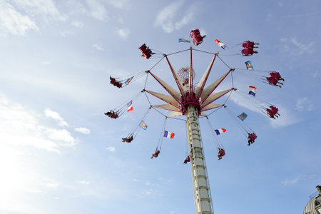 PARIS, FRANCE - AUGUST 09, 2015: amusement park near Louvre. Amusement parks evolved from European fairs and pleasure gardens, which were created for people's recreationのeditorial素材