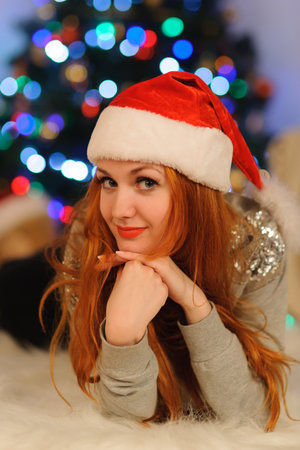 Studio shot of beautiful young woman during christmas holidaysの写真素材