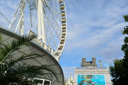 PARIS, FRANCE - AUGUST 09, 2015: amusement park near Louvre. Amusement parks evolved from European fairs and pleasure gardens, which were created for people's recreationのeditorial素材