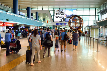ROME, ITALY - AUGUST 16, 2015: people in Fiumicino Airport. Fiumicino - Leonardo da Vinci International Airport is a major international airport in Rome, Italyのeditorial素材