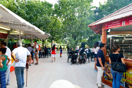 PARIS, FRANCE - AUGUST 09, 2015: amusement park near Louvre. Amusement parks evolved from European fairs and pleasure gardens, which were created for people's recreationのeditorial素材