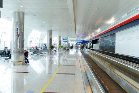 DUBAI, UAE - APRIL 18, 2014: the interior of Concourse A. The concourse includes one 4 star hotel and one 5 star hotel, first and business class lounges, and duty-free areasのeditorial素材