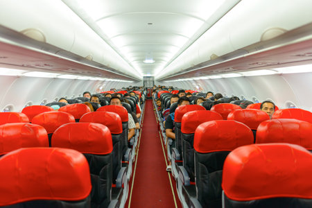 KUALA LUMPUR, MALAYSIA - MAY 02, 2014: AirAsia Airbus A320-200 interior. AirAsia Berhad is a Malaysian low-cost airline headquartered near Kuala Lumpur, Malaysiaのeditorial素材