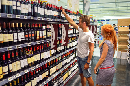 BEGLES, FRANCE - AUGUST 13, 2015: Simply Market supermarket customers. Simply Market is a brand of French supermarkets formed in 2005. This brand is a new concept to eventually replace Atac supermarketsのeditorial素材