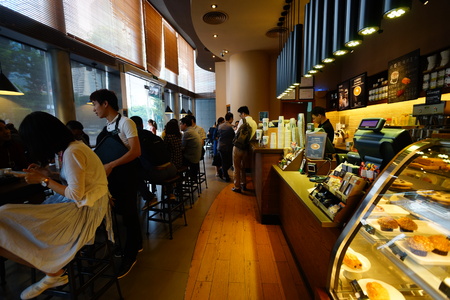 SHENZHEN, CHINA - OCTOBER 15, 2015: Starbucks Cafe interior. Starbucks Corporation is an American global coffee company and coffeehouse chain based in Seattle, Washingtonのeditorial素材