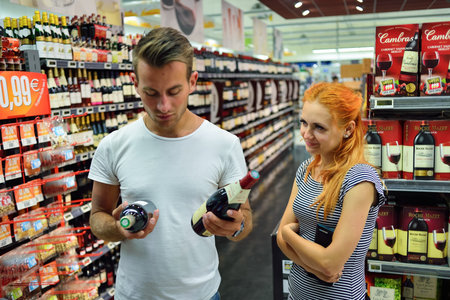 BEGLES, FRANCE - AUGUST 13, 2015: Simply Market supermarket customers. Simply Market is a brand of French supermarkets formed in 2005. This brand is a new concept to eventually replace Atac supermarketsのeditorial素材