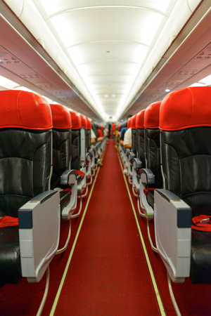 KUALA LUMPUR, MALAYSIA - MAY 02, 2014: AirAsia Airbus A320-200 interior. AirAsia Berhad is a Malaysian low-cost airline headquartered near Kuala Lumpur, Malaysiaのeditorial素材