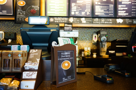 SHENZHEN, CHINA - OCTOBER 13, 2015: Starbucks Cafe interior. Starbucks Corporation is an American global coffee company and coffeehouse chain based in Seattle, Washingtonのeditorial素材