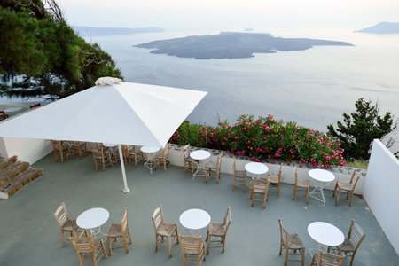 SANTORINI, GREECE - AUGUST 07, 2015: open air restaurant on Santorini island. The traditional architecture of Santorini is similar to that of the other Cyclades, with low-lying cubical housesのeditorial素材