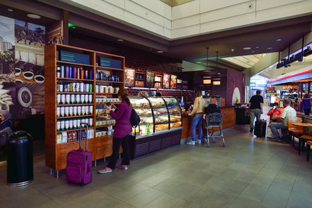DUBAI, UAE - SEPTEMBER 08, 2015: Starbucks cafe in Dubai Airport. Starbucks Corporation, doing business as Starbucks Coffee, is an American global coffee company and coffeehouse chain based in Seattle, Washingtonのeditorial素材